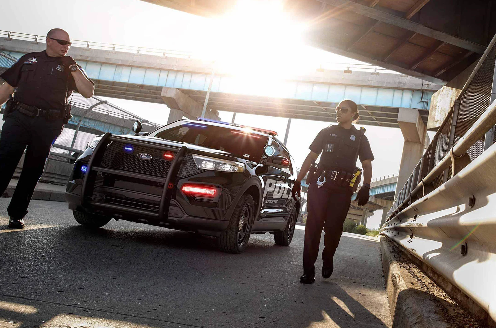 Officers with a Police Interceptor