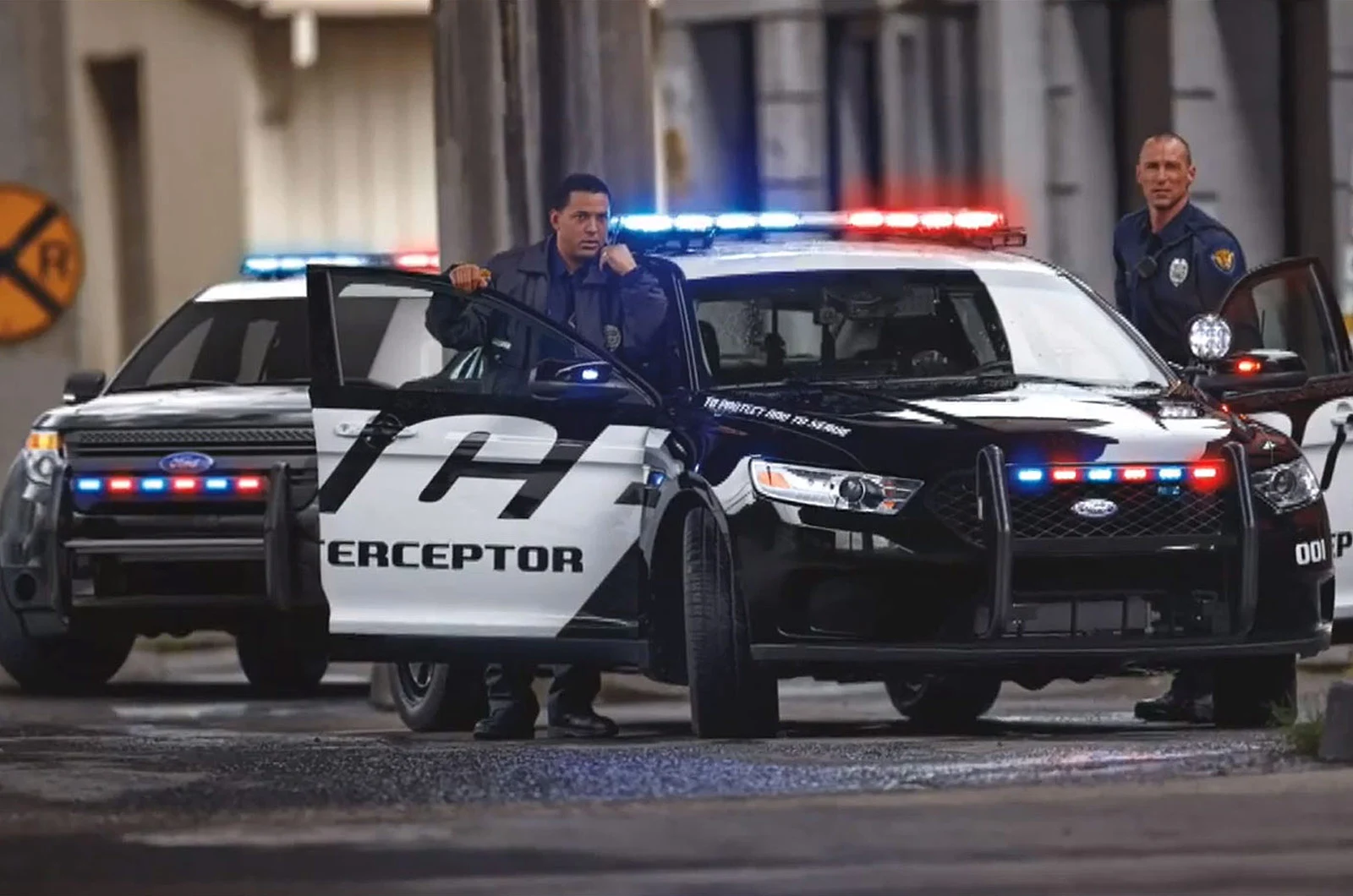 Officers using open vehicle doors during a demonstration